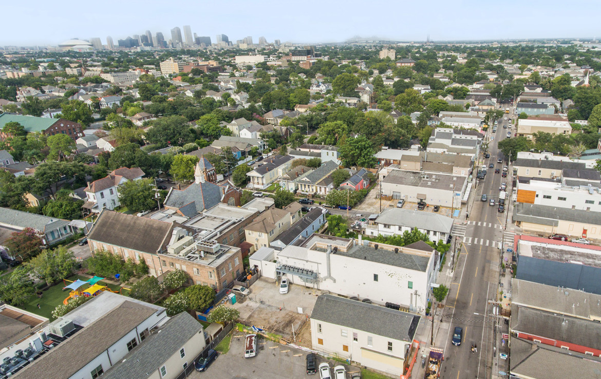 Aerial view of Magazine Street and surrounding neighborhood with background view of downtown New Orleans