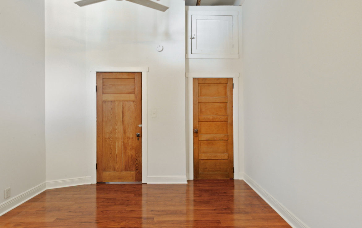 Unfurnished interior with wooden doors