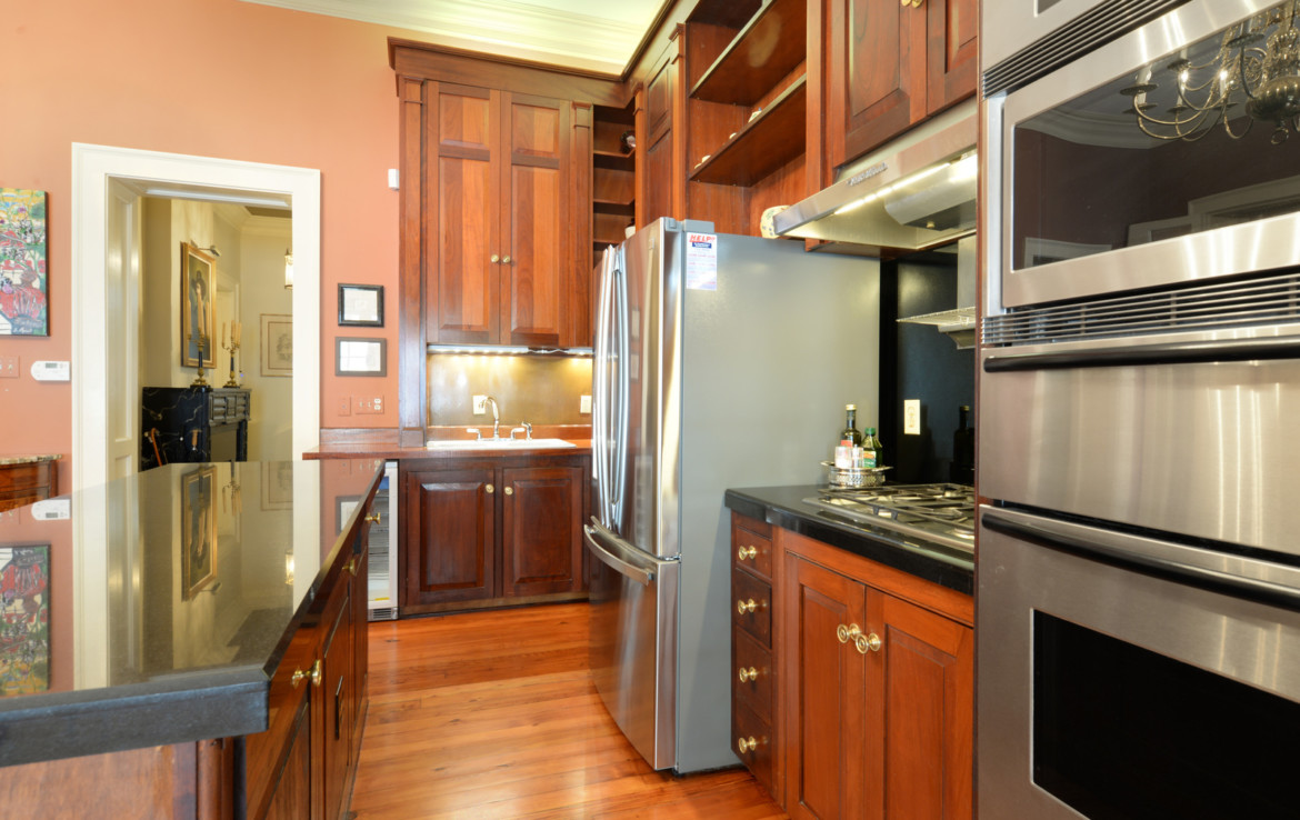 Side view of kitchen with wooden cabinets