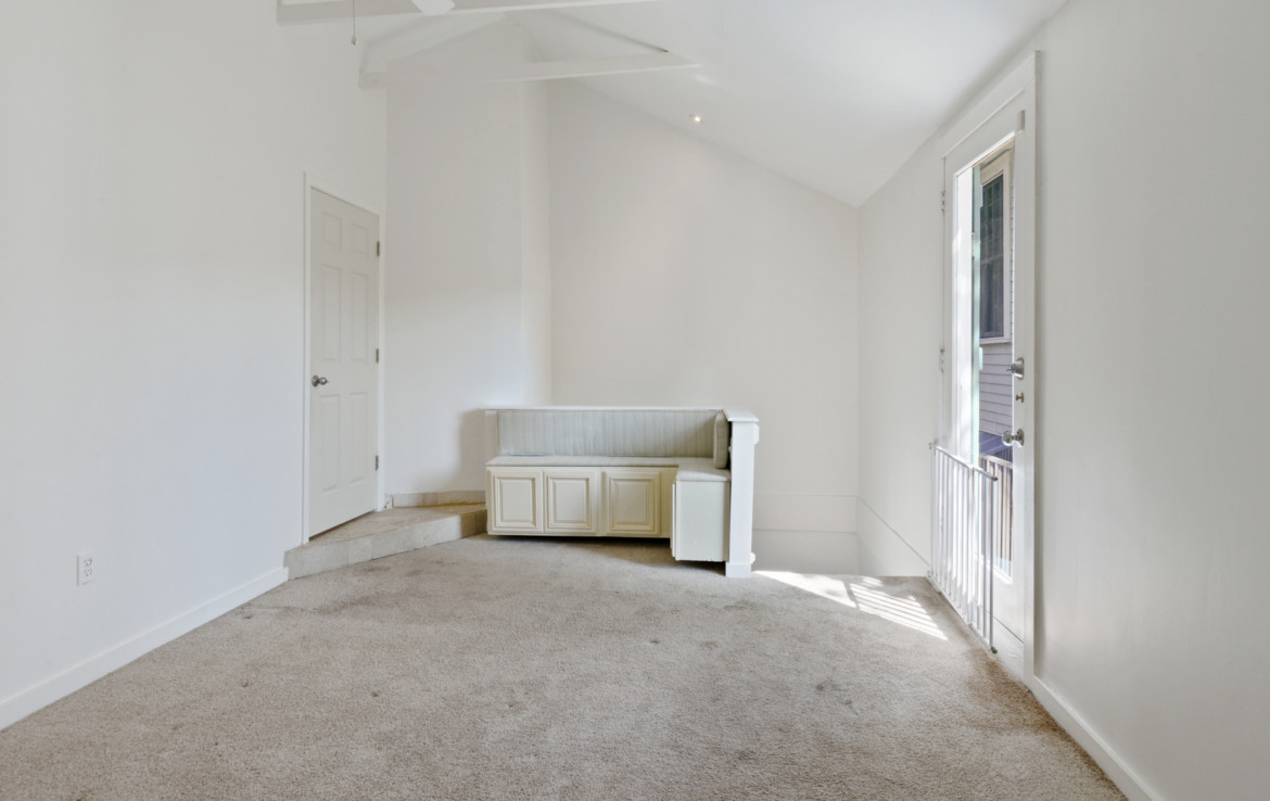 Unfurnished white room with nook seating