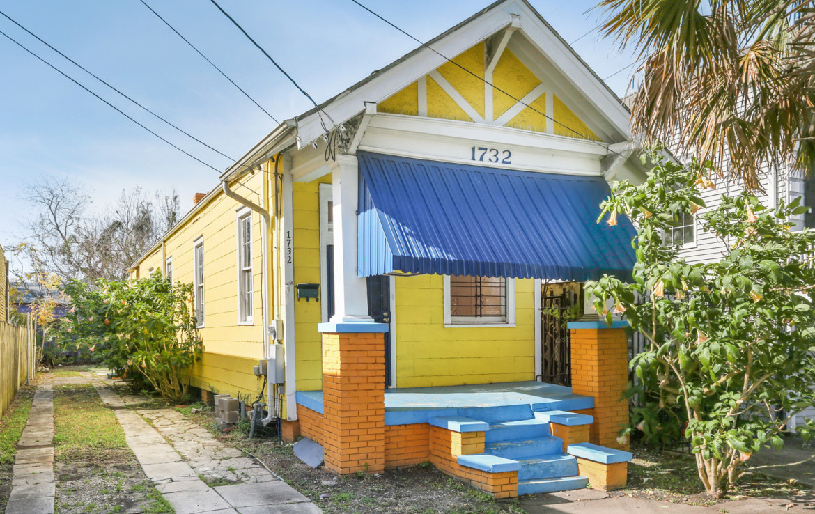 Angled view of yellow house