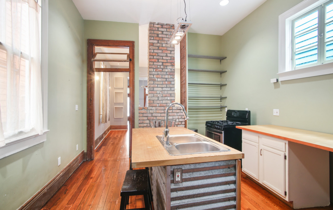 Kitchen with exposed brick