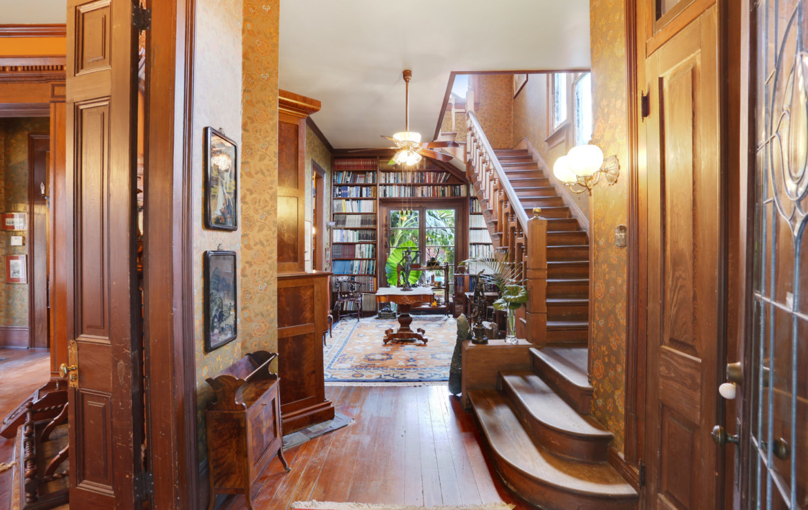 Furnished library room with the staircase
