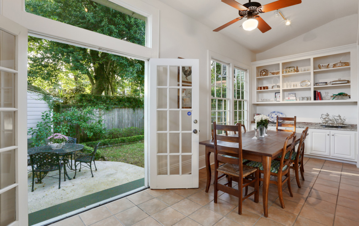 Furnished dining area with open exterior French doors
