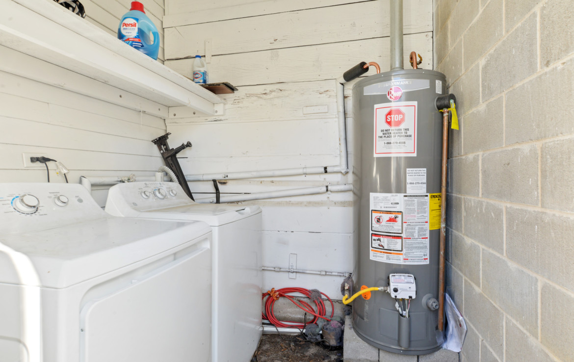 Laundry room next to water heater