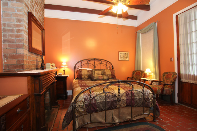 Downstairs bedroom with orange walls