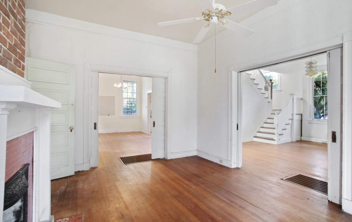 Unfurnished interior of house with white walls and wooden floors