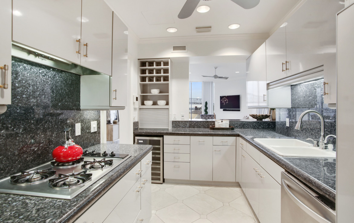 Kitchen with white cabinets and granite countertops