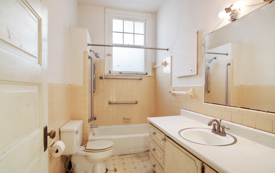 Bathroom with sink vanity, toilet, and bathtub