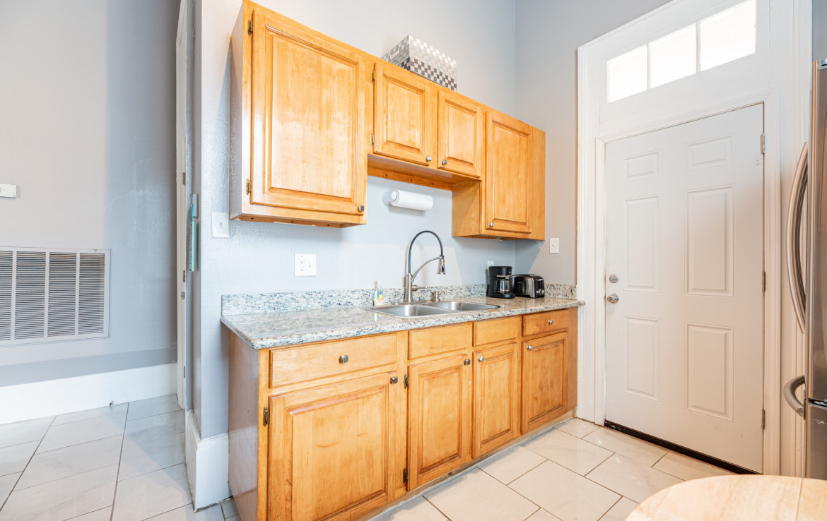 View of kitchen sink and cabinets