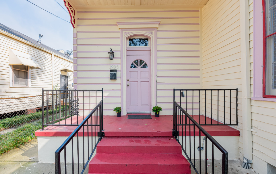 Front door with stairs leading to porch