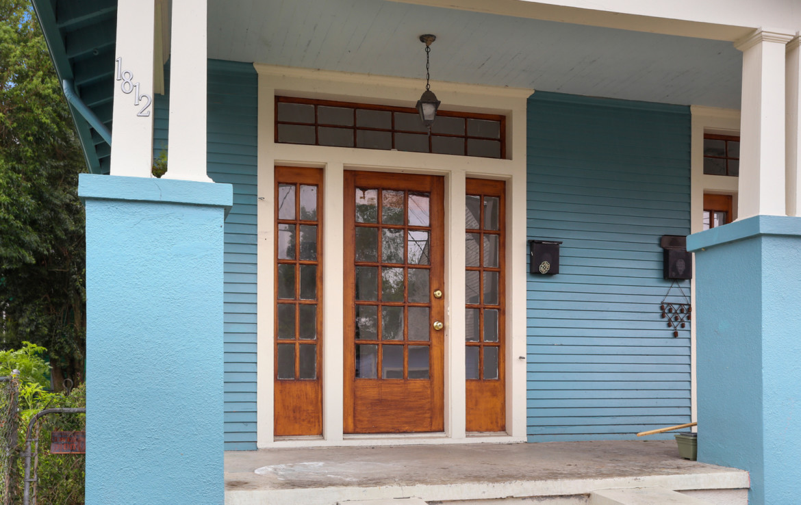 front door and porch of blue house