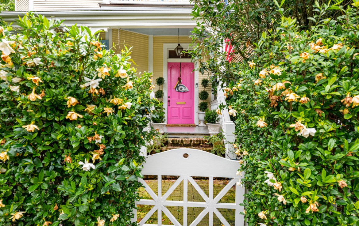 front porch with pink door