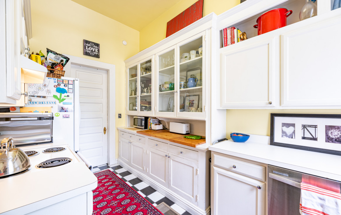 kitchen area with yellow walls