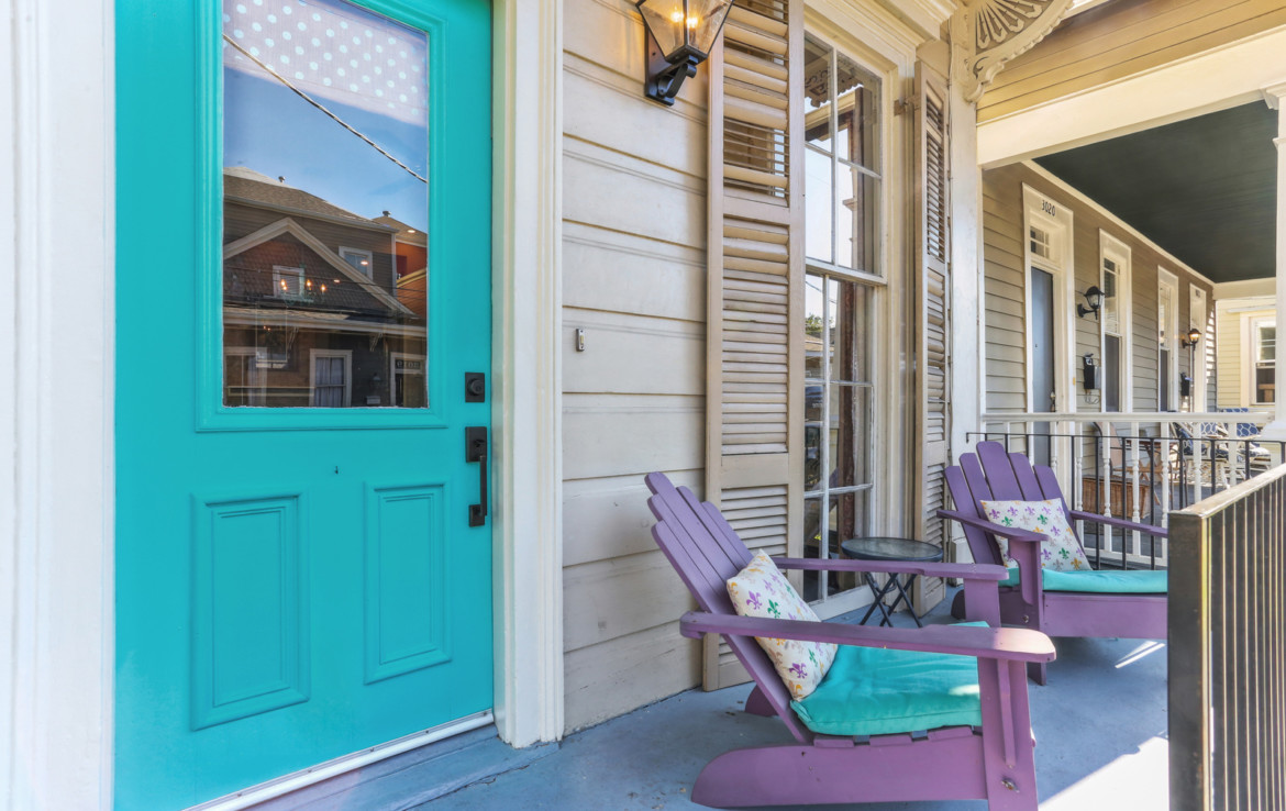 front porch with seating and aqua door