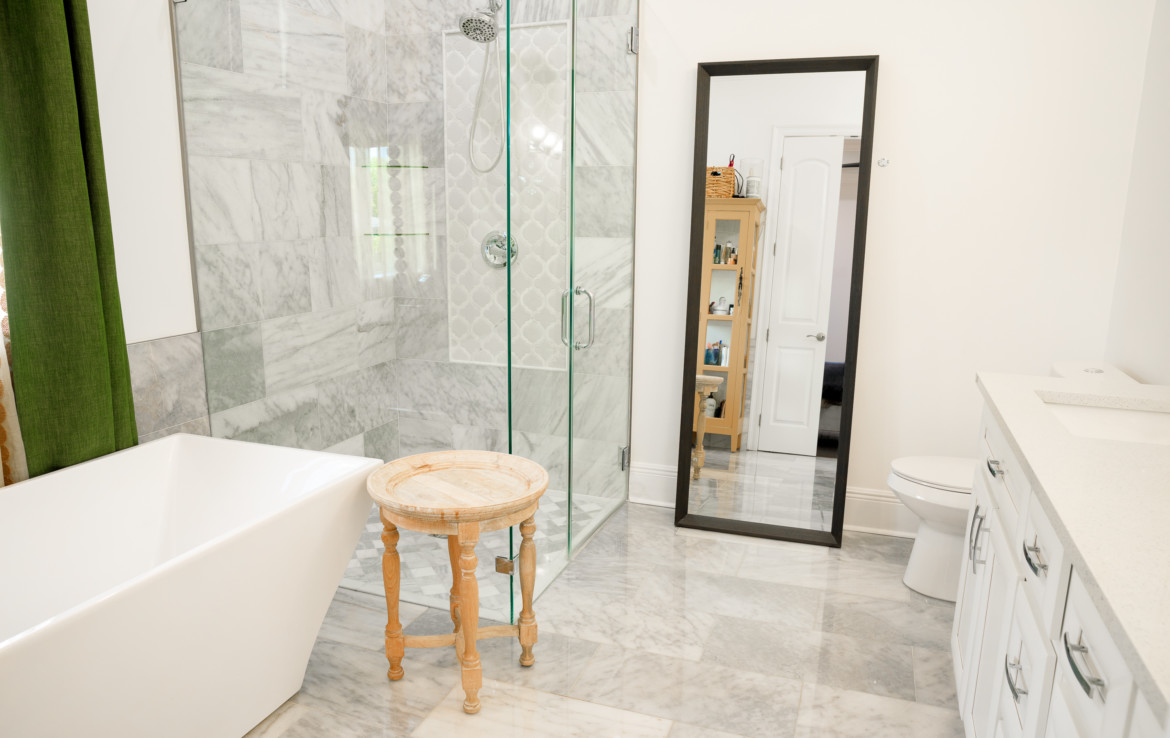 bathroom with tub and walk in shower