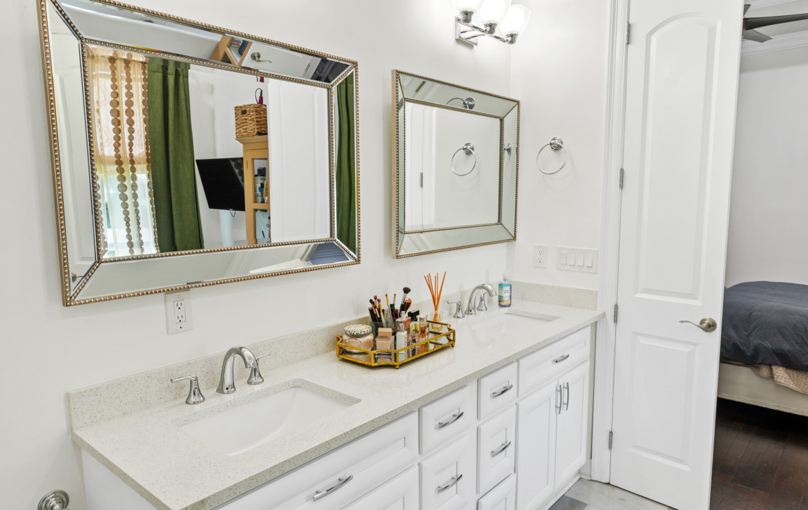 bathroom with twin vanity sinks