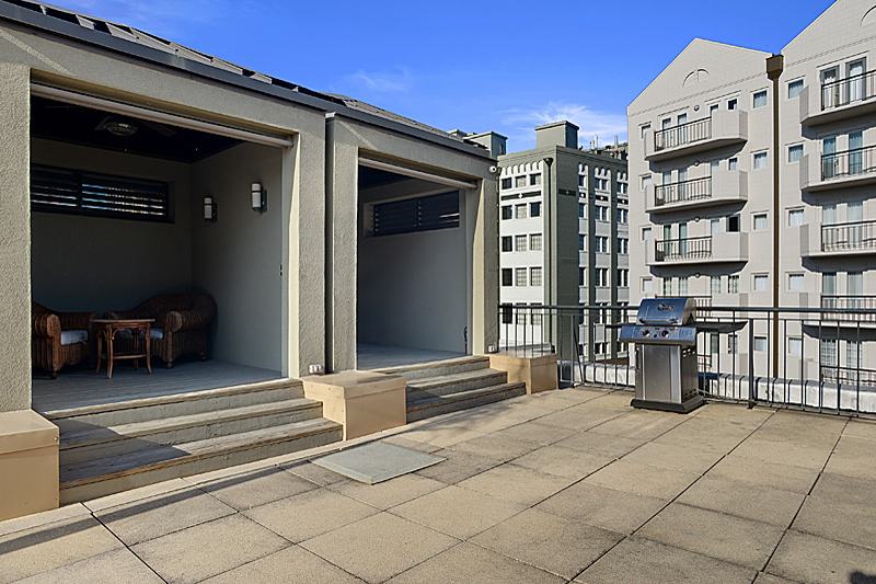 rooftop patio with covered seating area