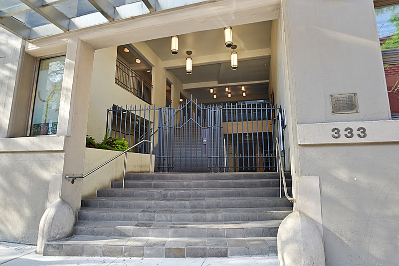 front view of porch and gate of multistory complex