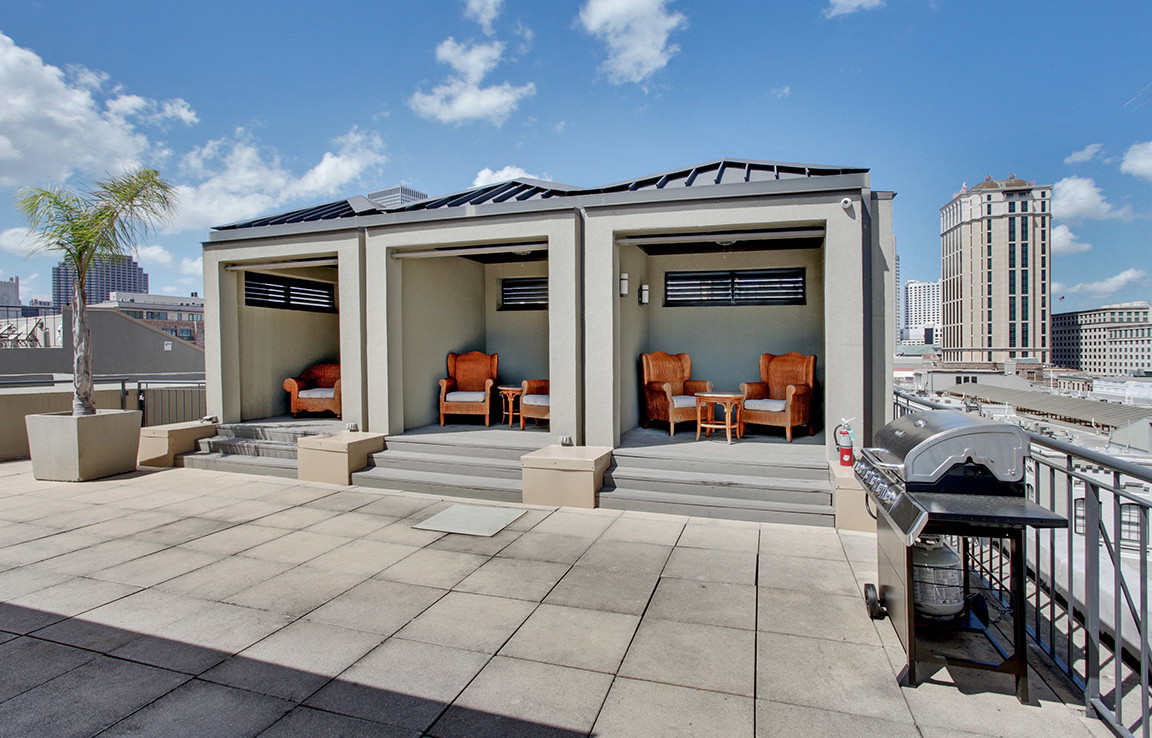 rooftop patio with three enclosed seating areas
