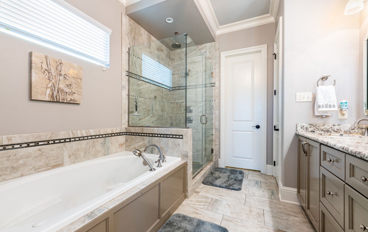 bathroom with tub and walk in shower