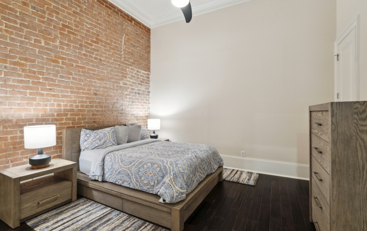 Bedroom with exposed brick