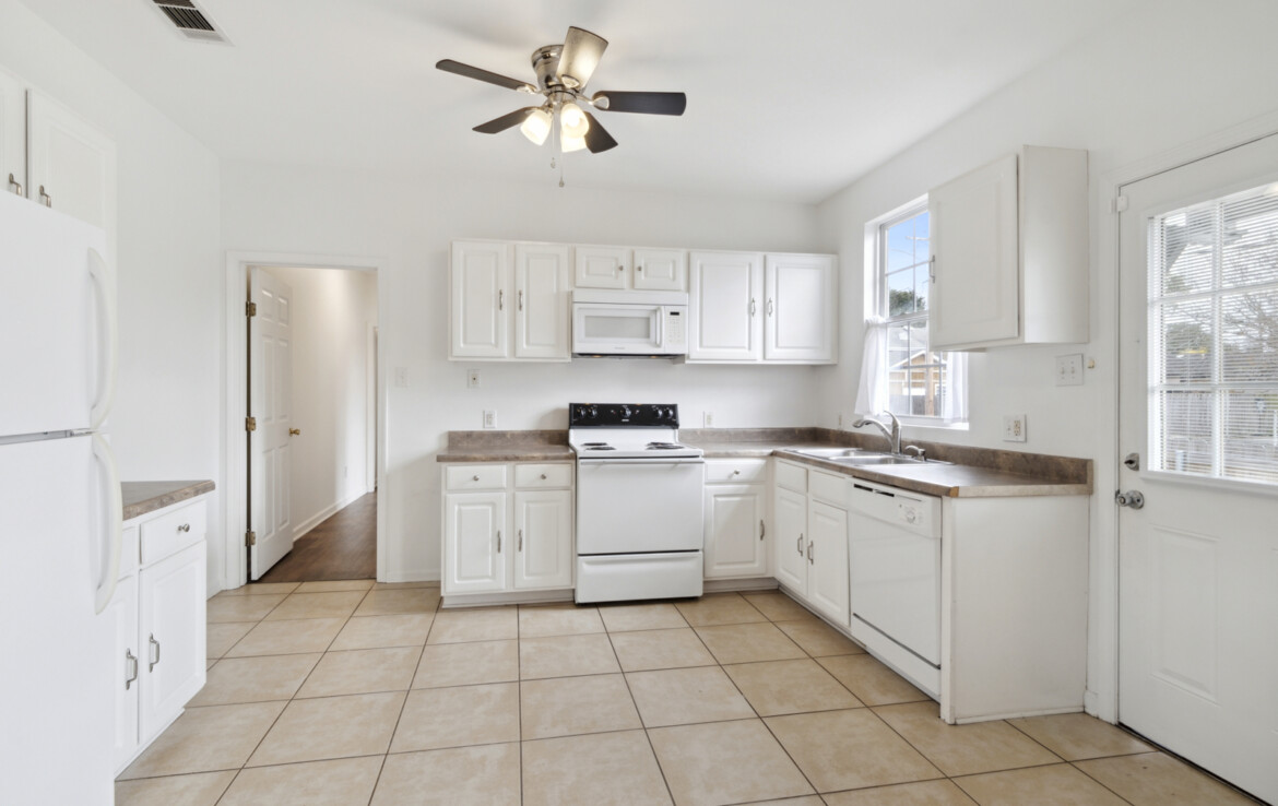 4901 Marigny kitchen w/ white appliances, tile floor