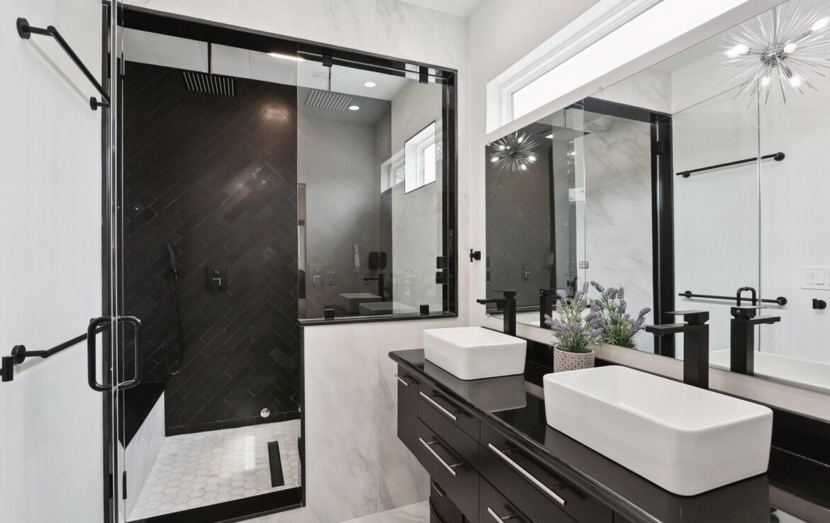 Primary bathroom with walk-in shower and double vanity