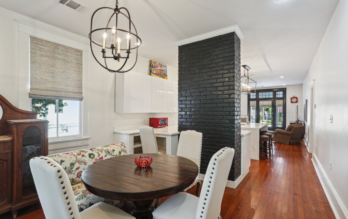 dining area exposed painted brick