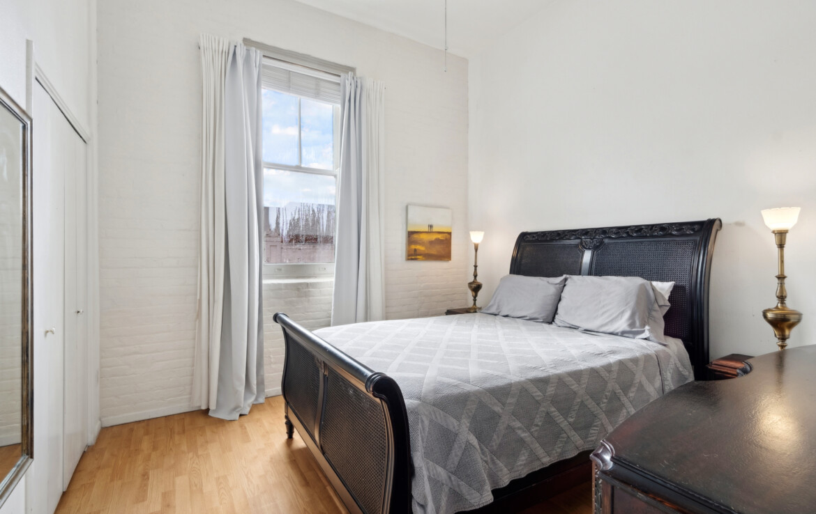 Bedroom with light from Julia St