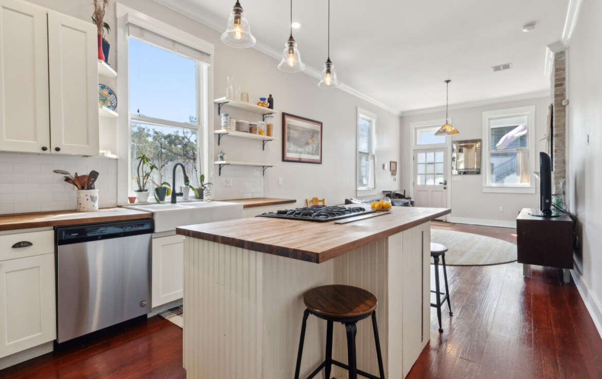 open concept kitchen, and living room. Natural light, kitchen island.