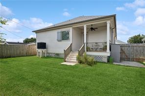 backyard, covered porch, fenced in yard